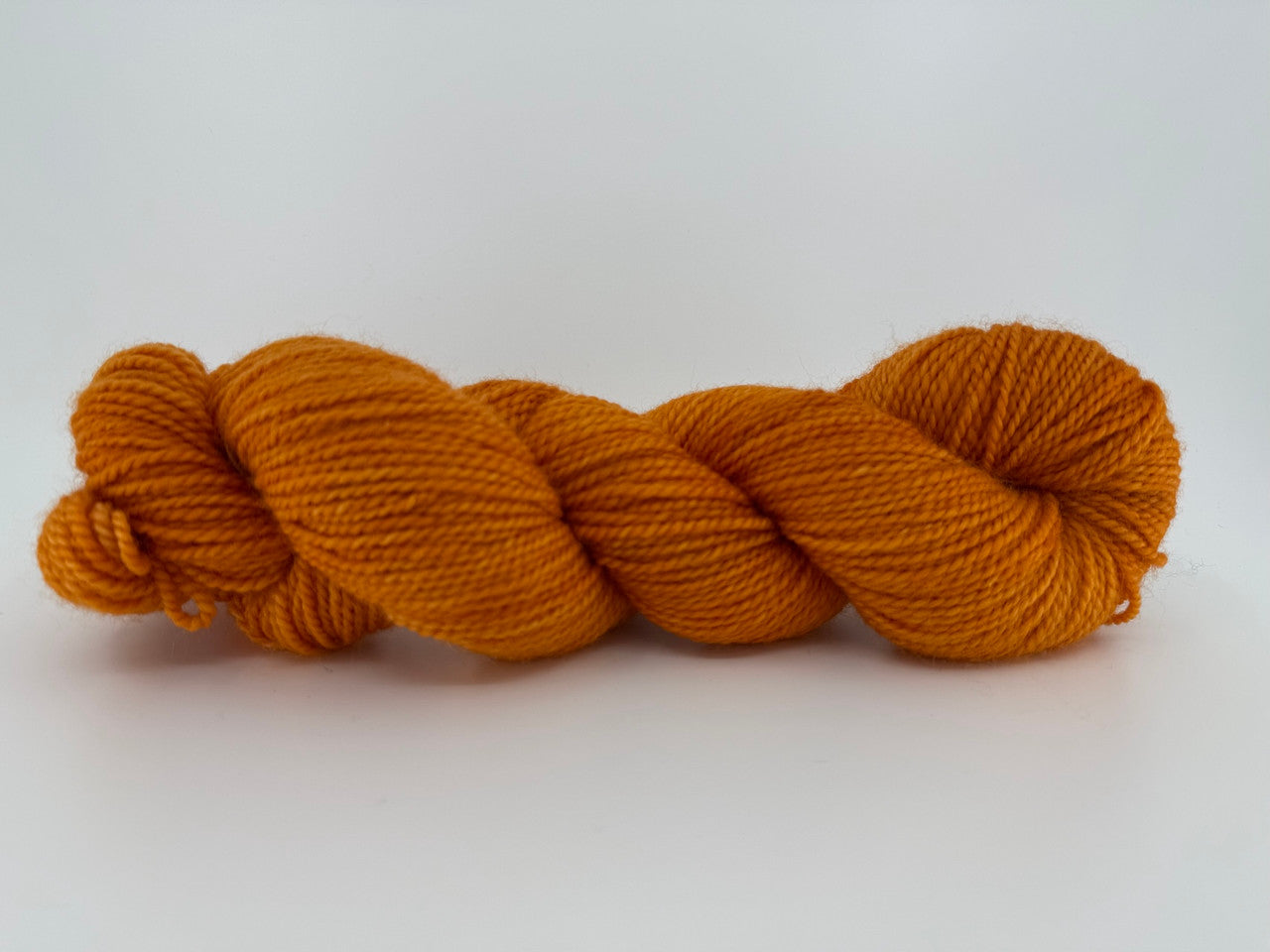 A skein of Feederbrook Farm BFL Solid yarn