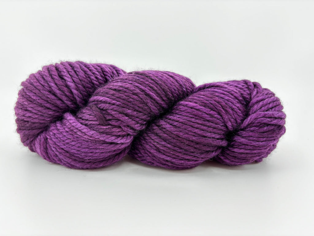 A skein of Malabrigo Chunky yarn in colorway Uva