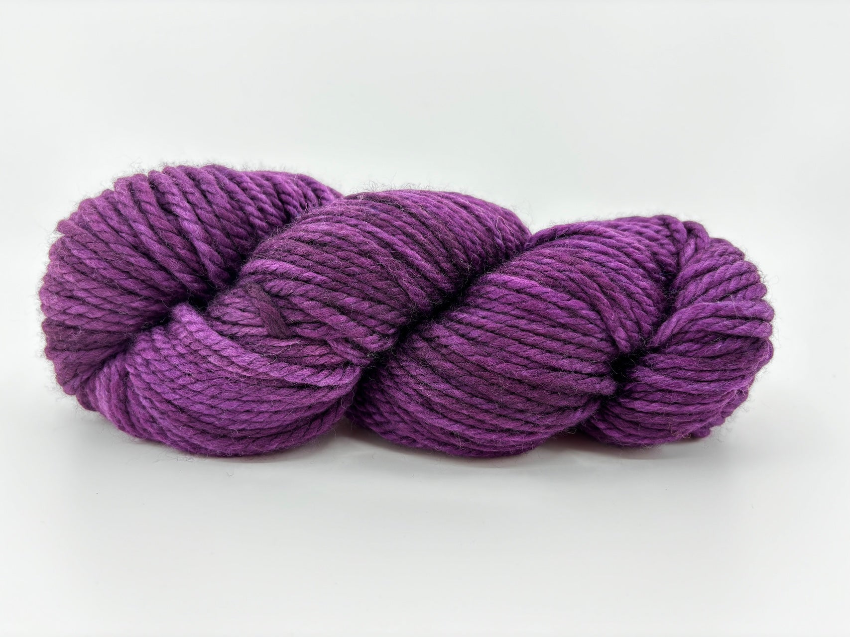 A skein of Malabrigo Chunky yarn in colorway Uva