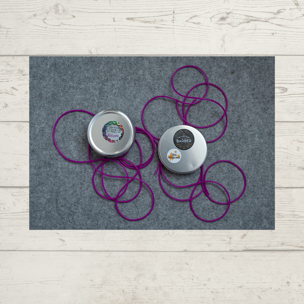 The Knitting Barber Cord Set, with the tin open and showing all the cords