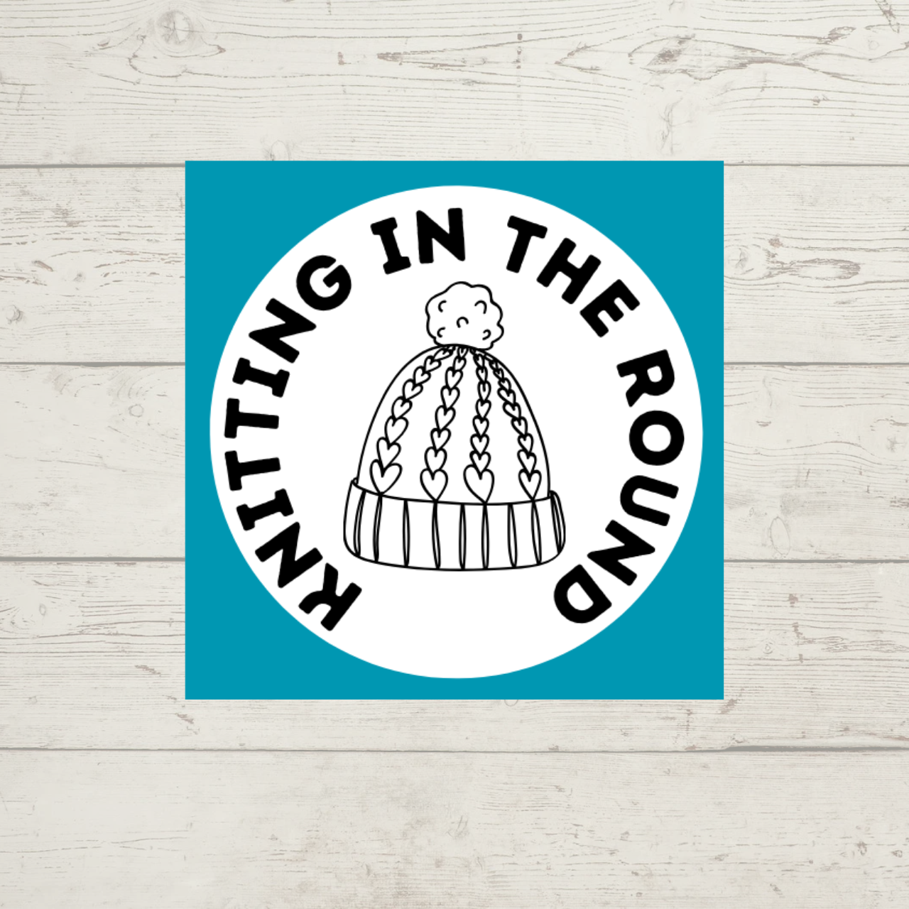 Knitting in the Round class -- picture shows a knitted hat with pom pom