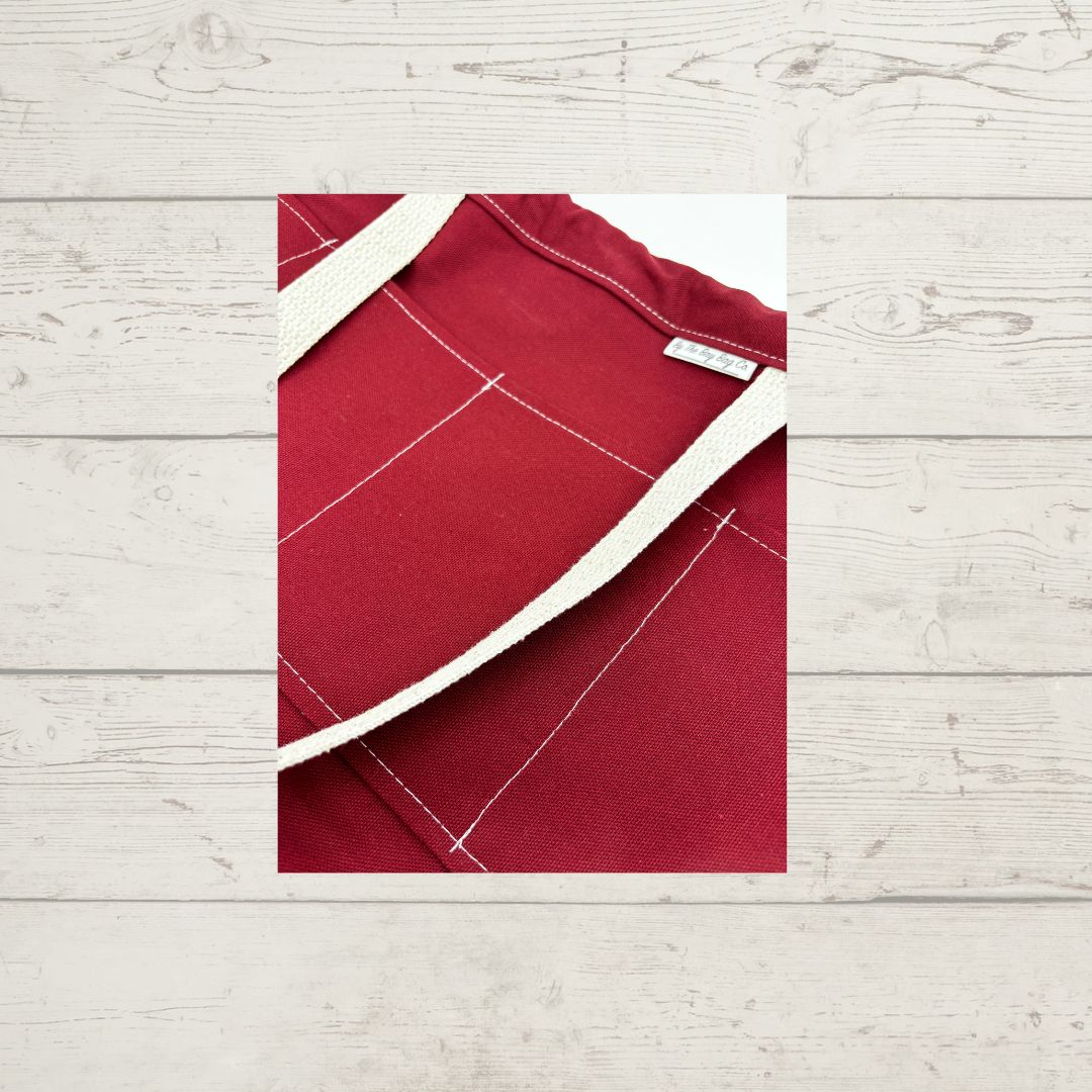 Detail of By The Bay Grande Tote, in maroon