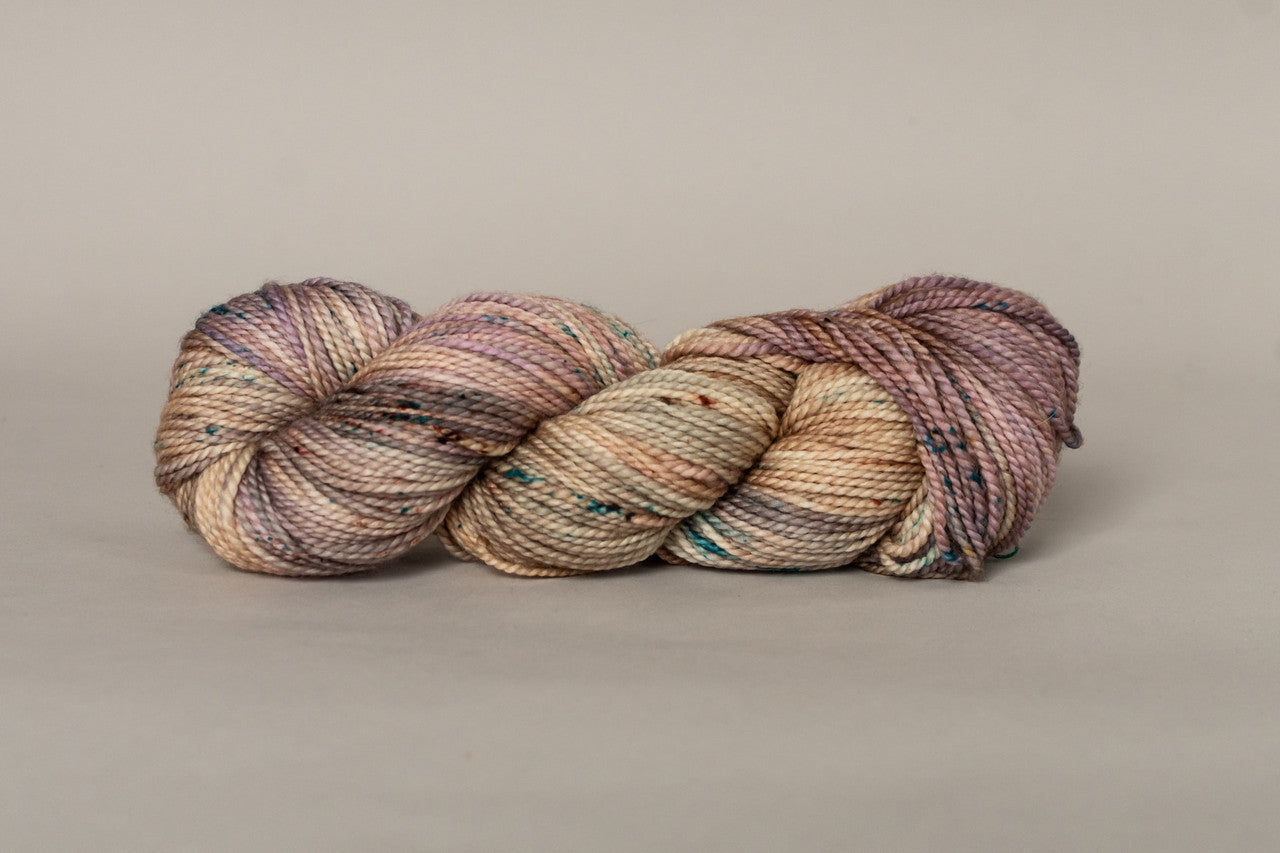 A skein of Madelinetosh Farm Twist in colorway Mars Rover