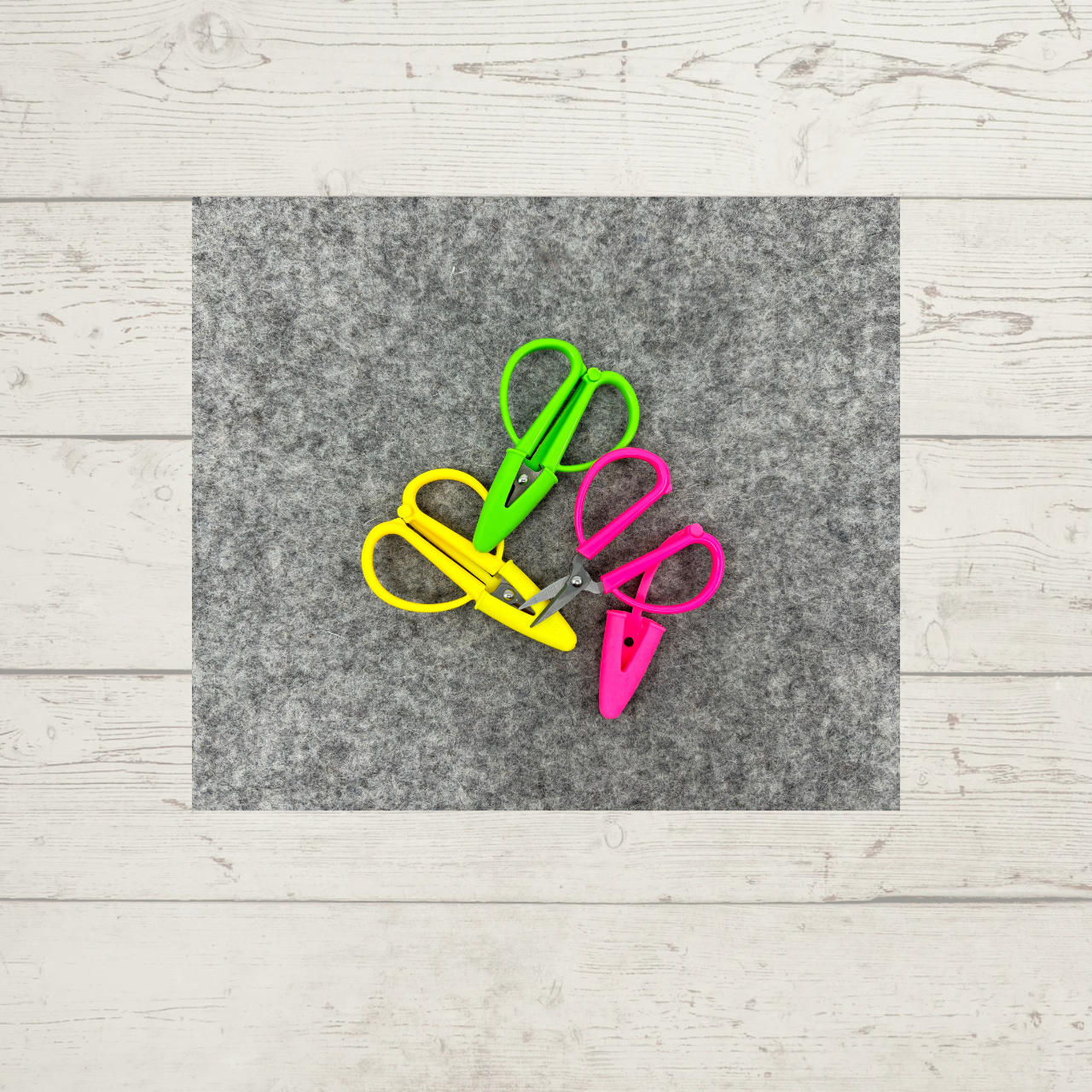 Super Snips, shown in yellow, pink, and green