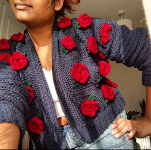 Krishna Varsani wearing one of her crochet cardigan designs