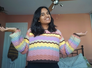 Krishna Varsani wearing one of her crochet sweater designs
